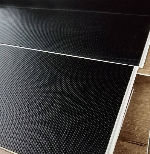 Cross-section of SPC flooring showing integrated IXPE acoustic backing.