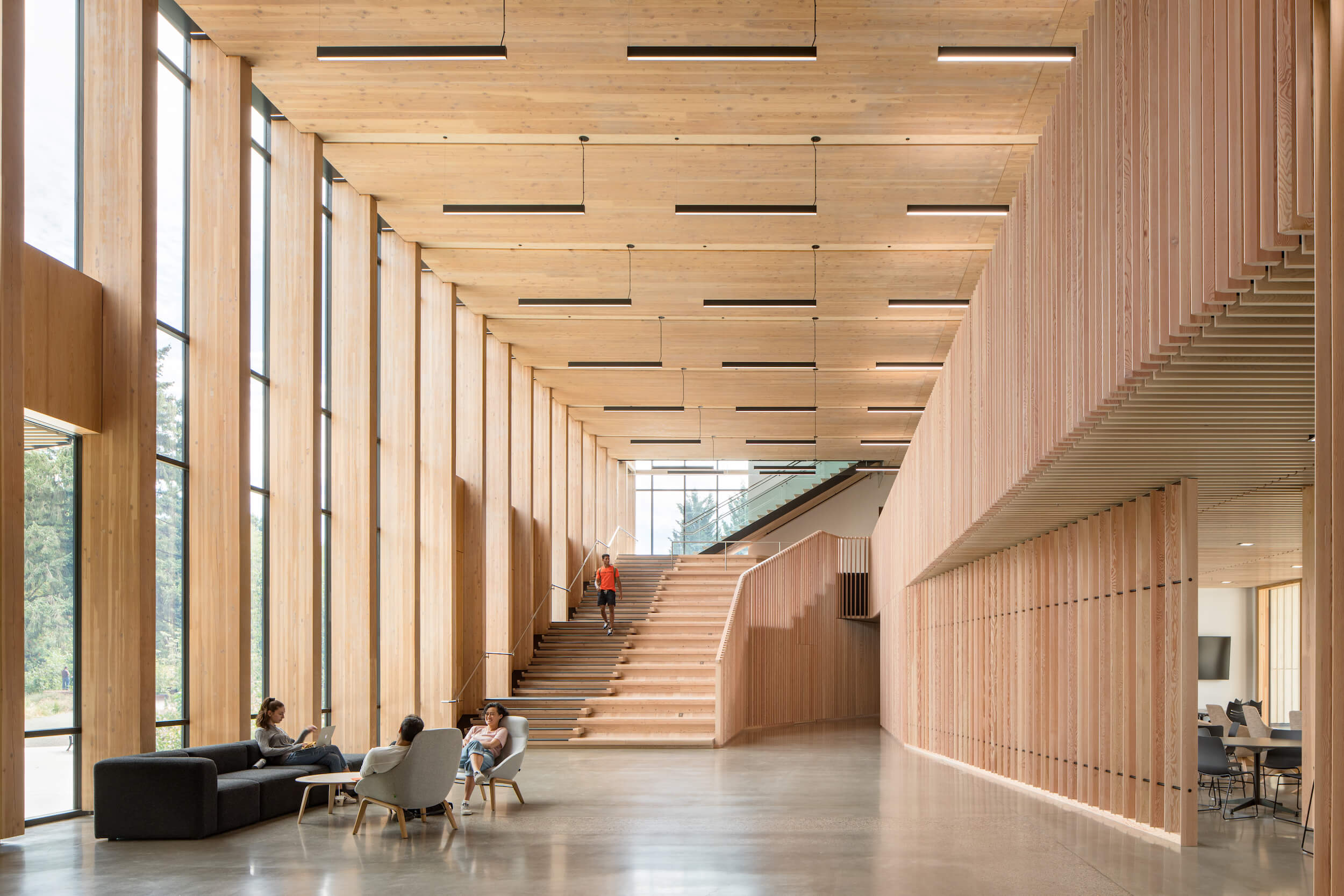 Timber ceiling and wall cladding in a double-height interior by BeautexWood